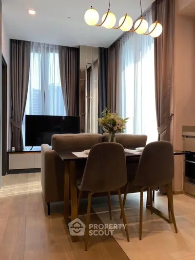 Modern living room with elegant dining area and large windows
