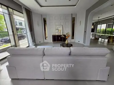 Luxurious living room with elegant decor and spacious seating area, perfect for modern living.