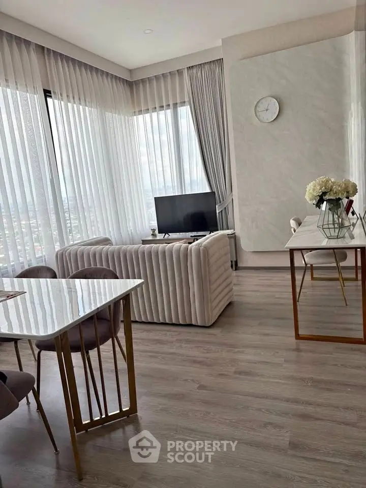 Luxurious modern living room with panoramic windows and elegant decor