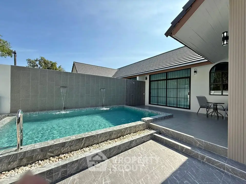 Luxurious modern home with private pool and elegant patio area, perfect for relaxation and entertainment.