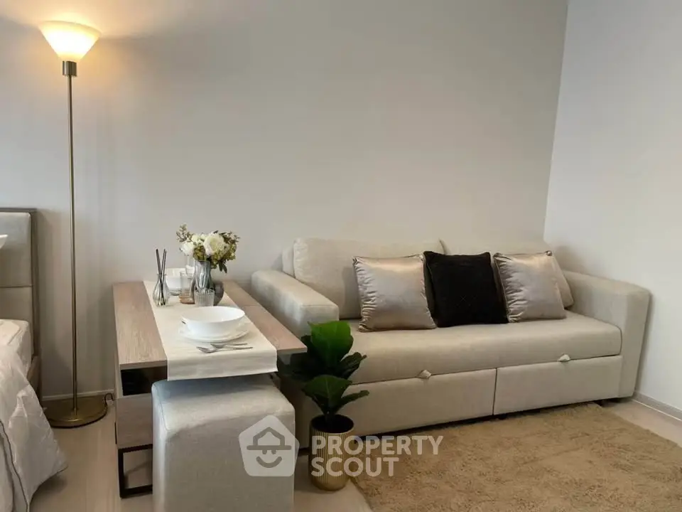 Cozy living room with elegant beige sofa and stylish decor