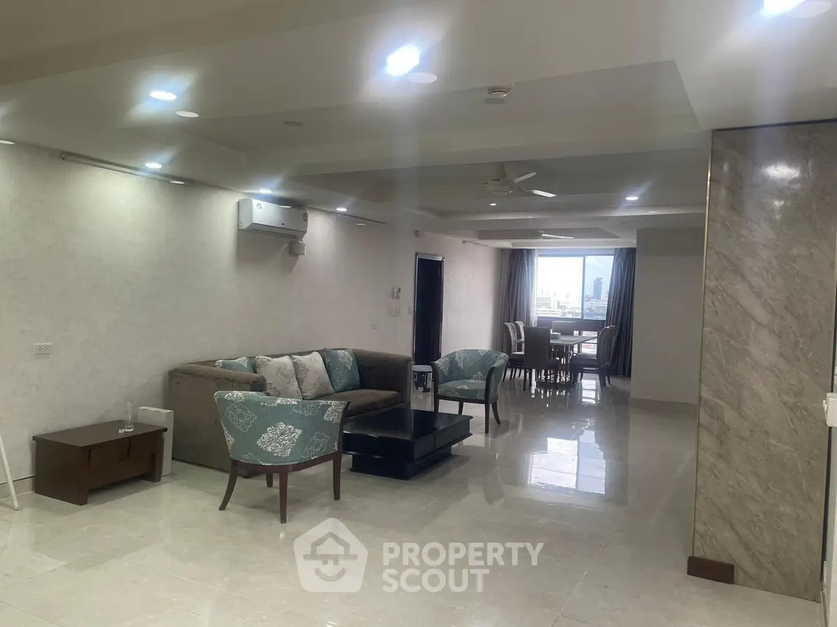 Spacious modern living room with elegant furniture and open dining area