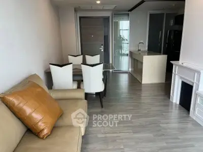 Modern open-plan living room with dining area and sleek kitchen design