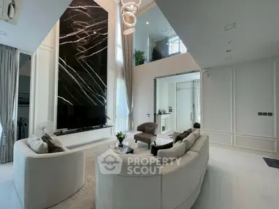 Luxurious modern living room with high ceilings and elegant decor