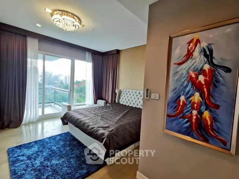 Luxurious bedroom with elegant decor and balcony view