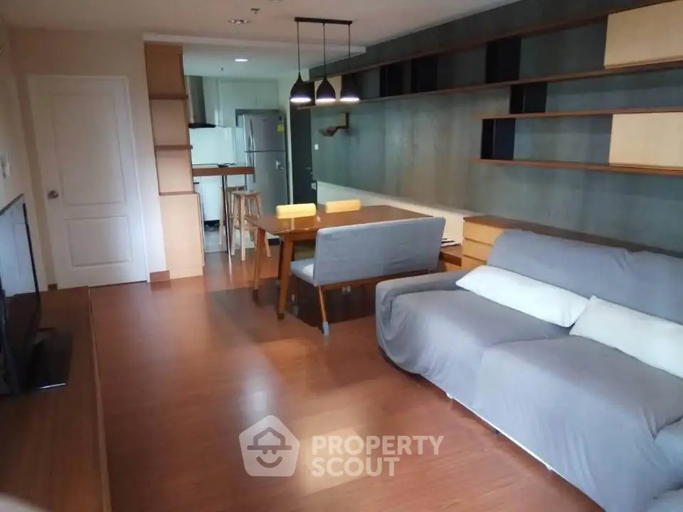 Modern living room with open kitchen and stylish furniture