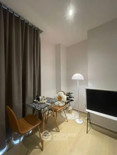 Cozy dining area with modern decor and stylish lighting in a contemporary apartment.