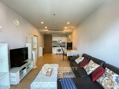 Spacious modern living room with open kitchen and stylish decor