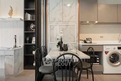 Modern kitchen with marble accents and integrated washing machine