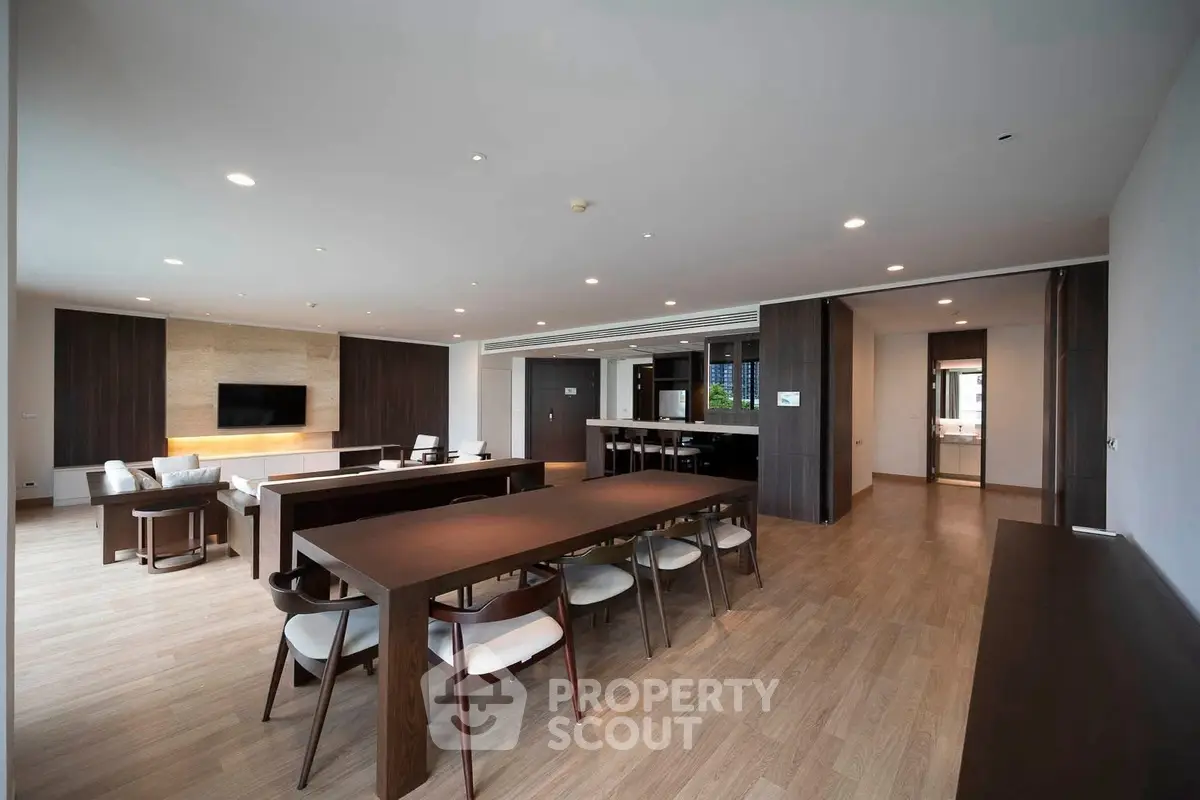 Spacious modern living room with elegant dining area and wooden flooring