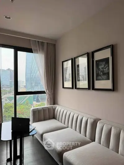 Modern living room with elegant sofa and city view, perfect for urban living.