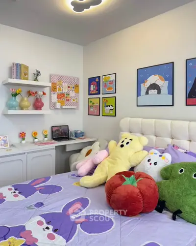 Charming bedroom with playful decor and plush toys, perfect for a cozy and inviting atmosphere.