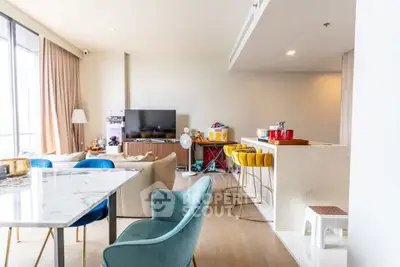 Spacious modern living room with stylish furniture and open kitchen layout