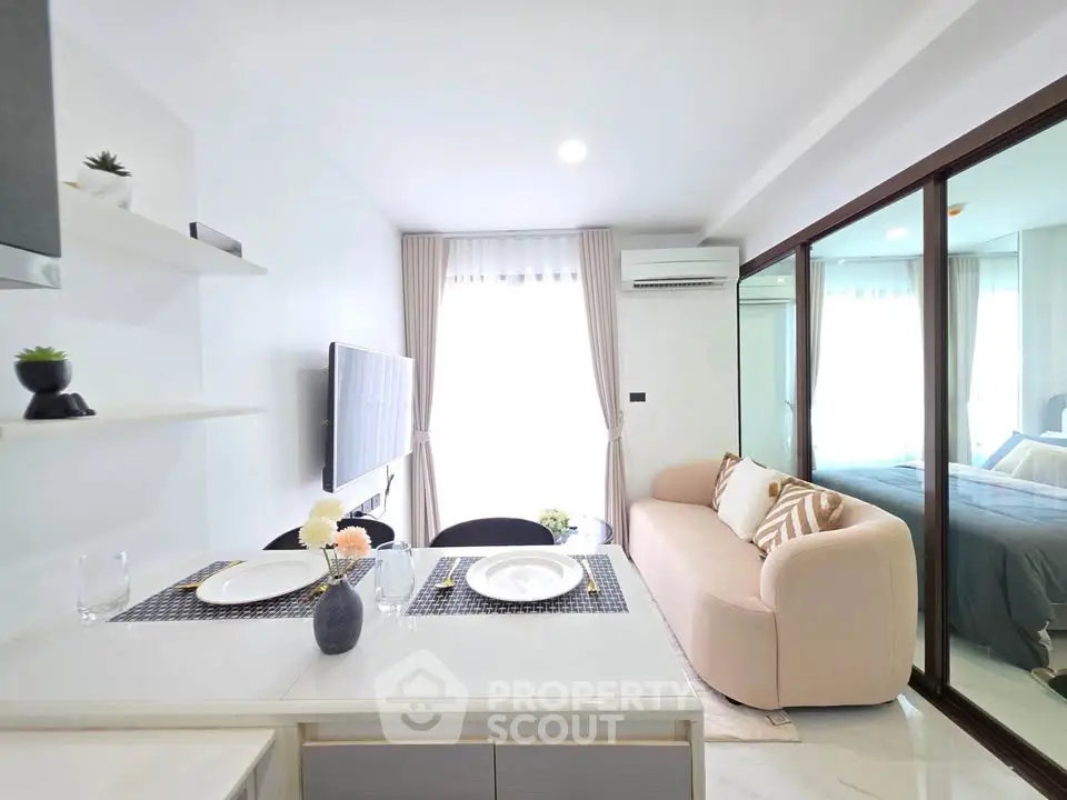 Modern living room with cozy sofa and dining area in bright apartment