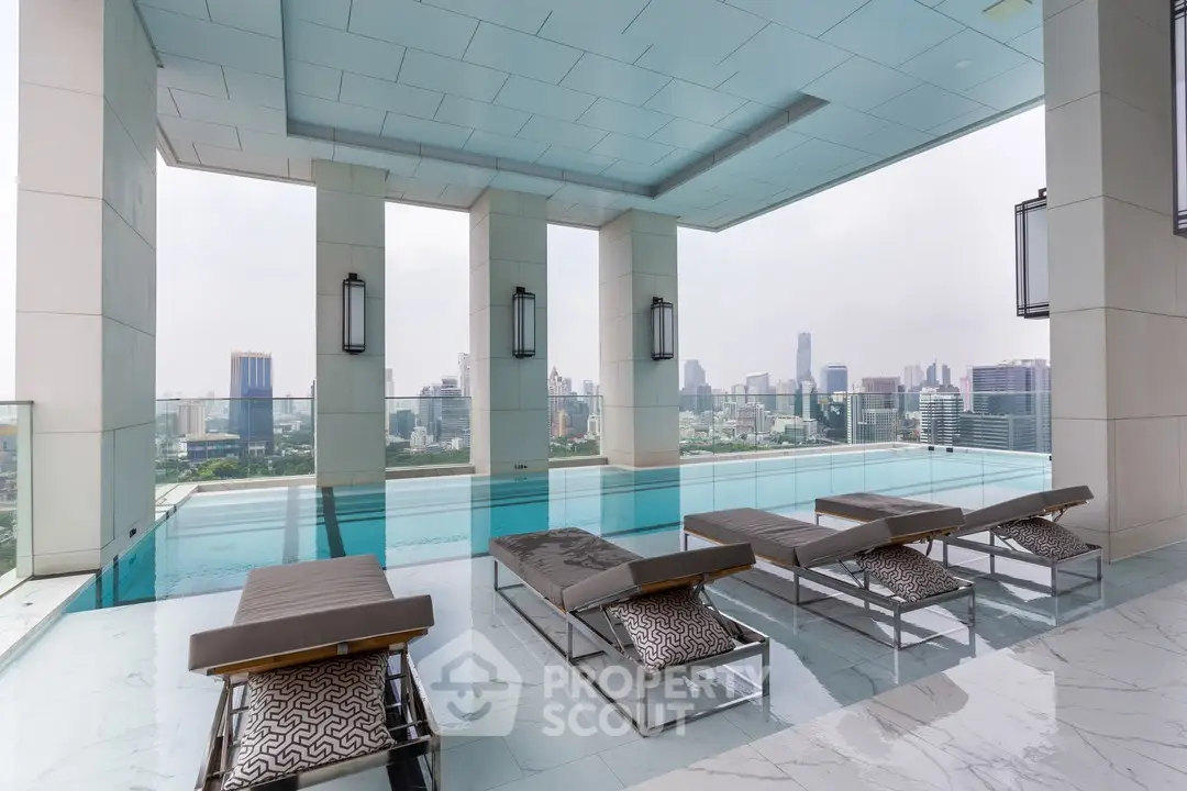 Luxurious rooftop pool with stunning city skyline views and modern lounge chairs.