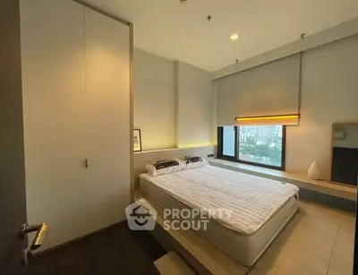 Modern bedroom with large window and minimalist design
