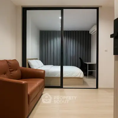 Modern apartment with cozy bedroom and stylish living area, featuring sleek furniture and elegant design.
