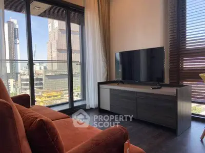 Modern living room with city view and sleek furniture