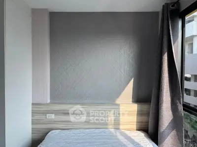 Modern bedroom with stylish wall design and large window for natural light