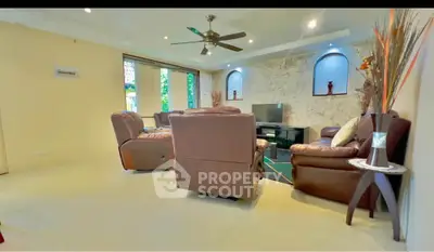 Spacious living room with leather sofas and modern decor