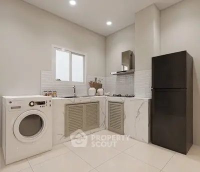 Modern kitchen with marble countertops, washing machine, and sleek appliances in a stylish open layout.