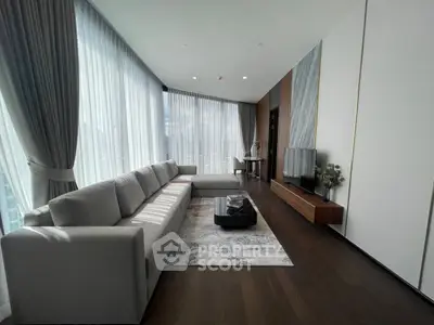 Luxurious modern living room with floor-to-ceiling windows and elegant decor