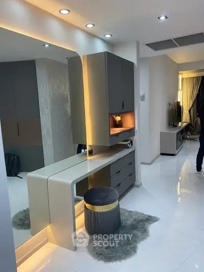 Modern interior with sleek furniture and ambient lighting in a stylish living space.