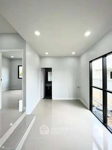 Modern minimalist interior with glossy floors and large windows