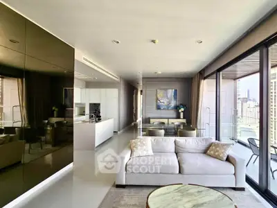Luxurious modern living room with open kitchen and city view balcony, perfect for urban living.
