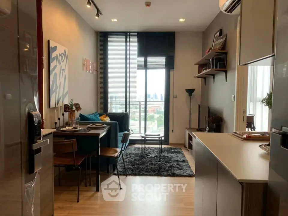 Modern living room with city view, stylish decor, and open layout in urban apartment.
