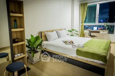 Modern bedroom with city view, stylish decor, and cozy ambiance perfect for urban living.