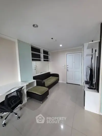 Modern living room with sleek furniture and built-in storage, perfect for urban living.