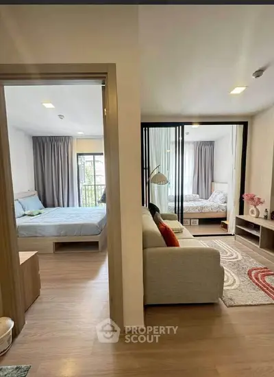 Modern apartment interior with two bedrooms and cozy living area, featuring stylish decor and natural light.