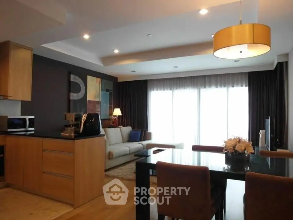 Modern open-plan living room with stylish decor and natural light