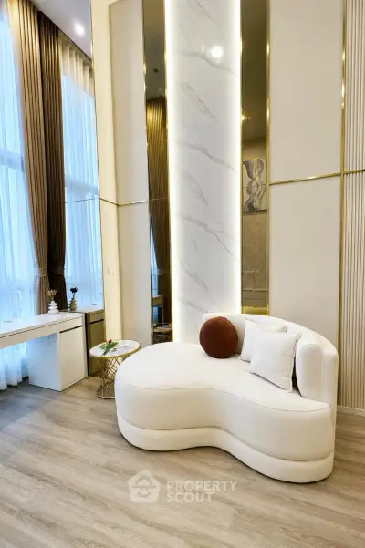 Luxurious modern living room with elegant white sofa and floor-to-ceiling windows