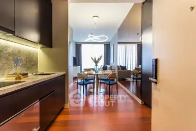 Luxurious modern living room with open kitchen and elegant dining area