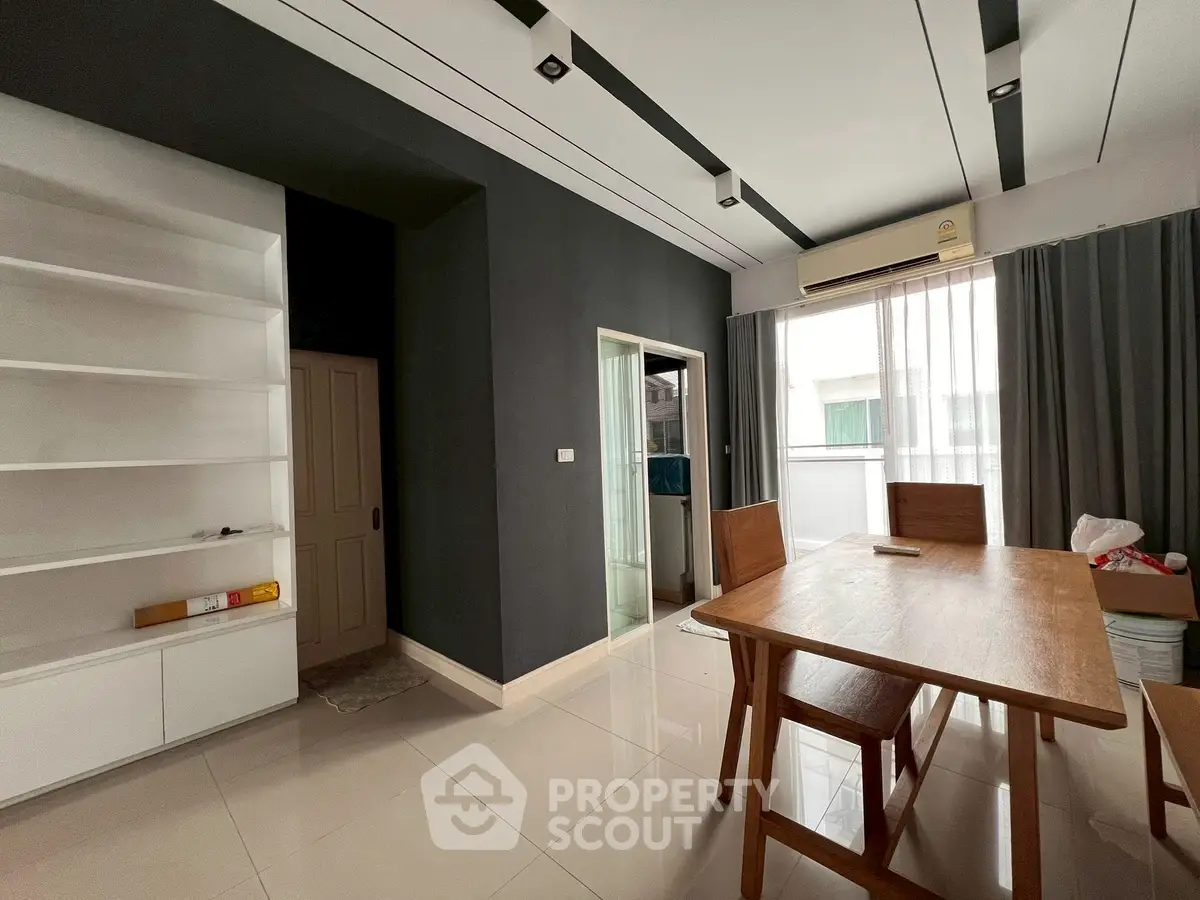 Modern dining area with sleek design and natural light