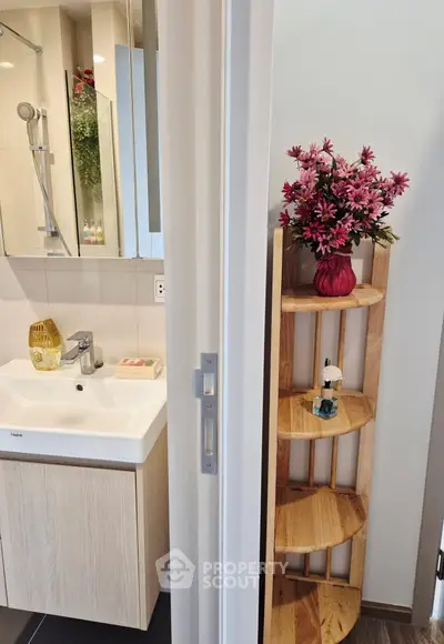 Modern bathroom with stylish sink and decorative shelving unit
