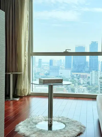 Luxurious high-rise apartment with stunning city view and elegant interior design.