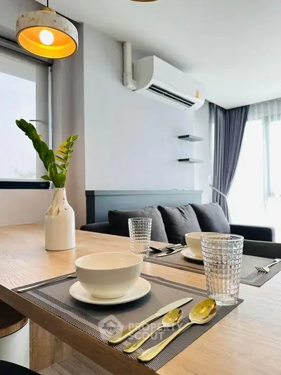 Modern living room with stylish dining setup and cozy seating area