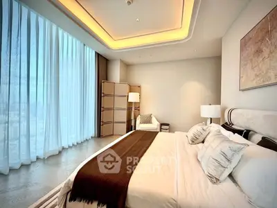 Luxurious bedroom with floor-to-ceiling windows and elegant decor in modern apartment.