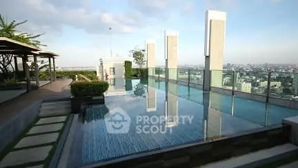 Luxurious rooftop pool with stunning city view and modern design.