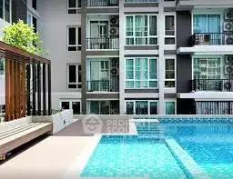 Modern apartment building with poolside view and balconies