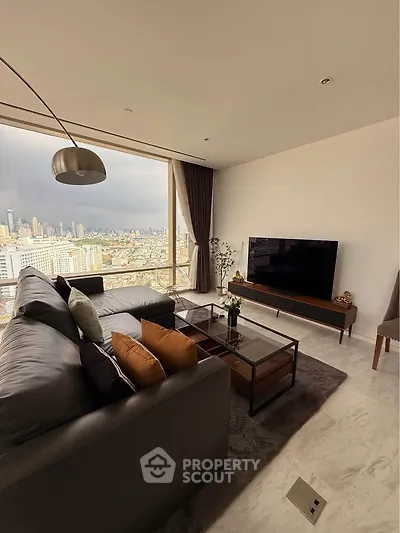 Luxurious living room with stunning city view, modern furniture, and floor-to-ceiling windows.