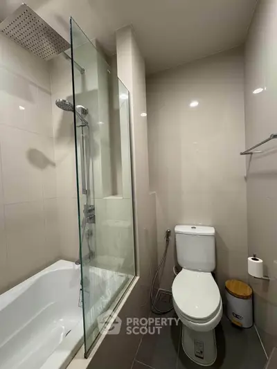 Modern bathroom with glass shower and sleek fixtures