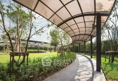 Beautifully landscaped garden with a modern walkway and lush greenery in a serene setting.