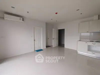 Spacious modern apartment with sleek kitchen and air conditioning, perfect for comfortable living.