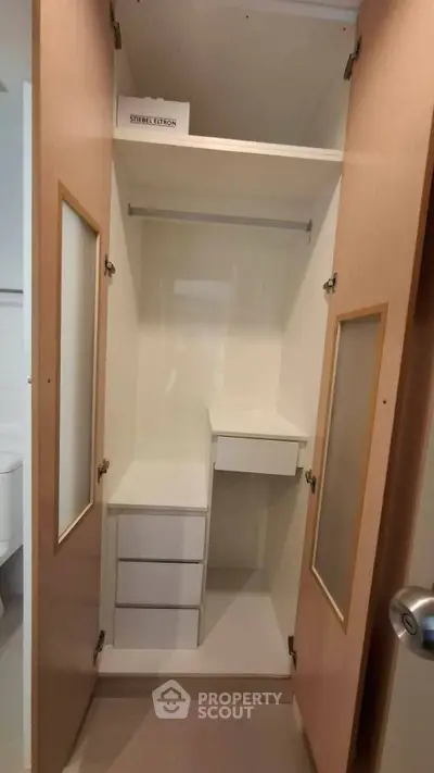 Spacious built-in closet with ample storage and sleek design