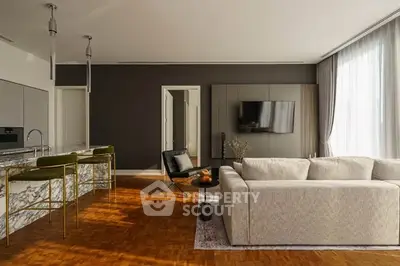 Luxurious modern living room with open kitchen and elegant decor