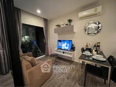 Modern living room with stylish decor and dining area in open layout apartment